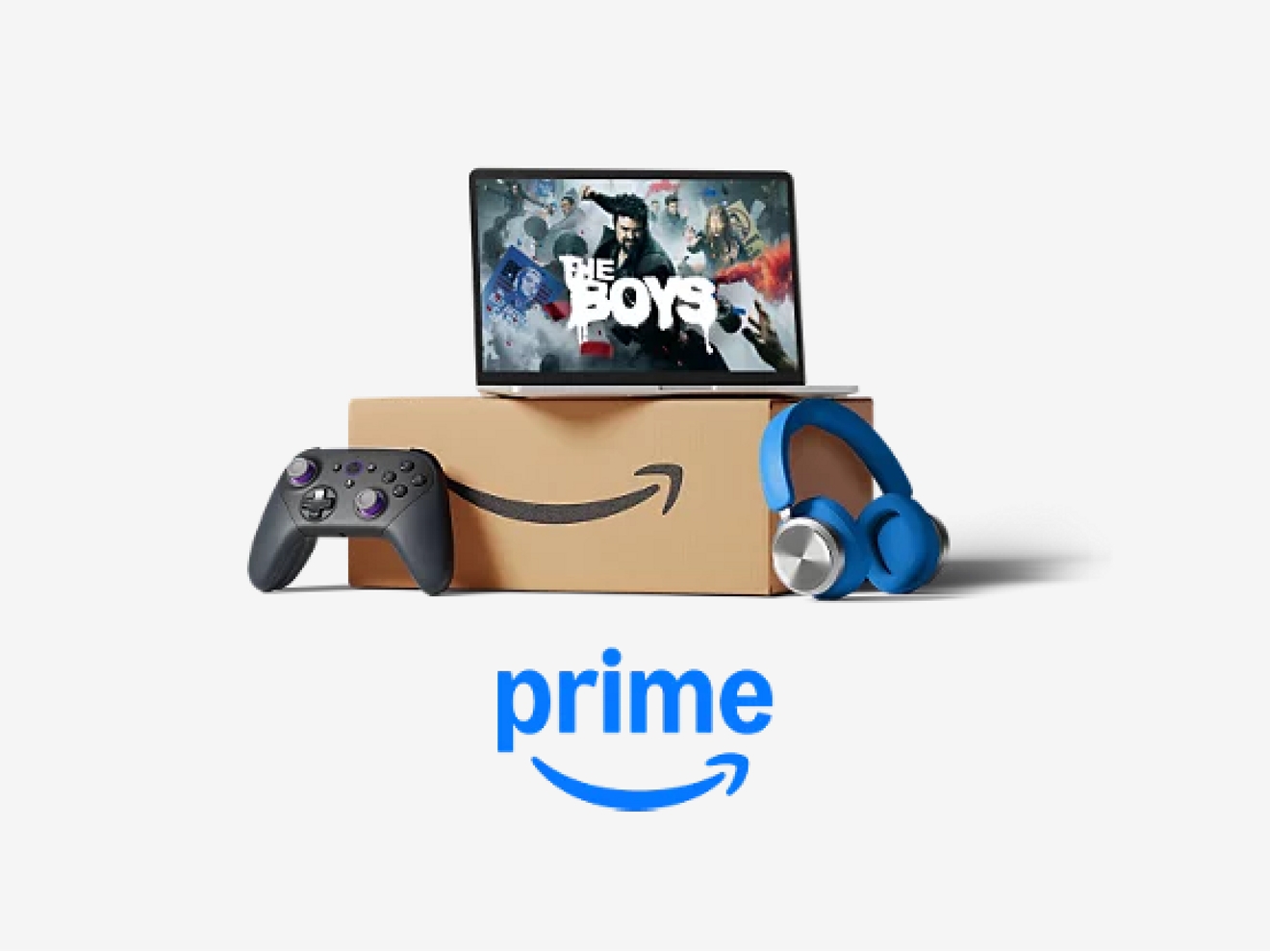 Laptop with Amazon Prime show promos on it sitting on top of an Amazon box with game controller and headphones leaning against it.